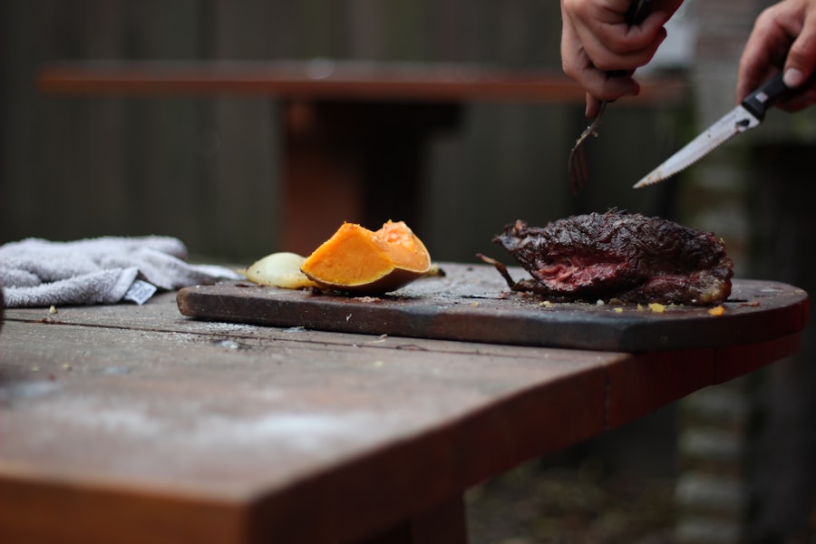 Hands carving a juicy medium-rare cut from the parrilla