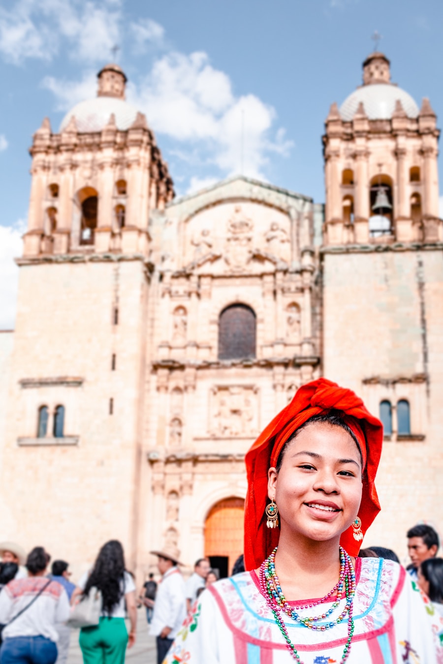 Crowd gathered in front of a sunlit Mexican cathedral