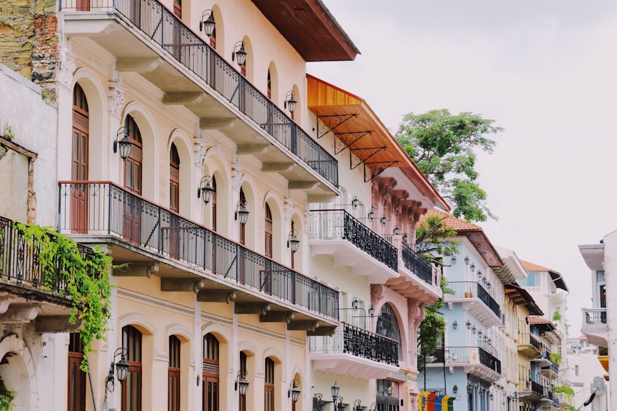 Row of colonial balconies above leafy Casco Viejo street