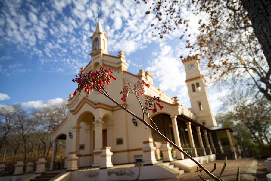 Whitewashed mission church with cross-topped tower