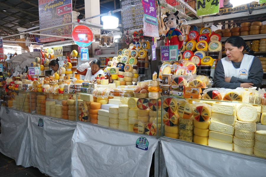 Cusco market stall heaped with golden Andean cheeses
