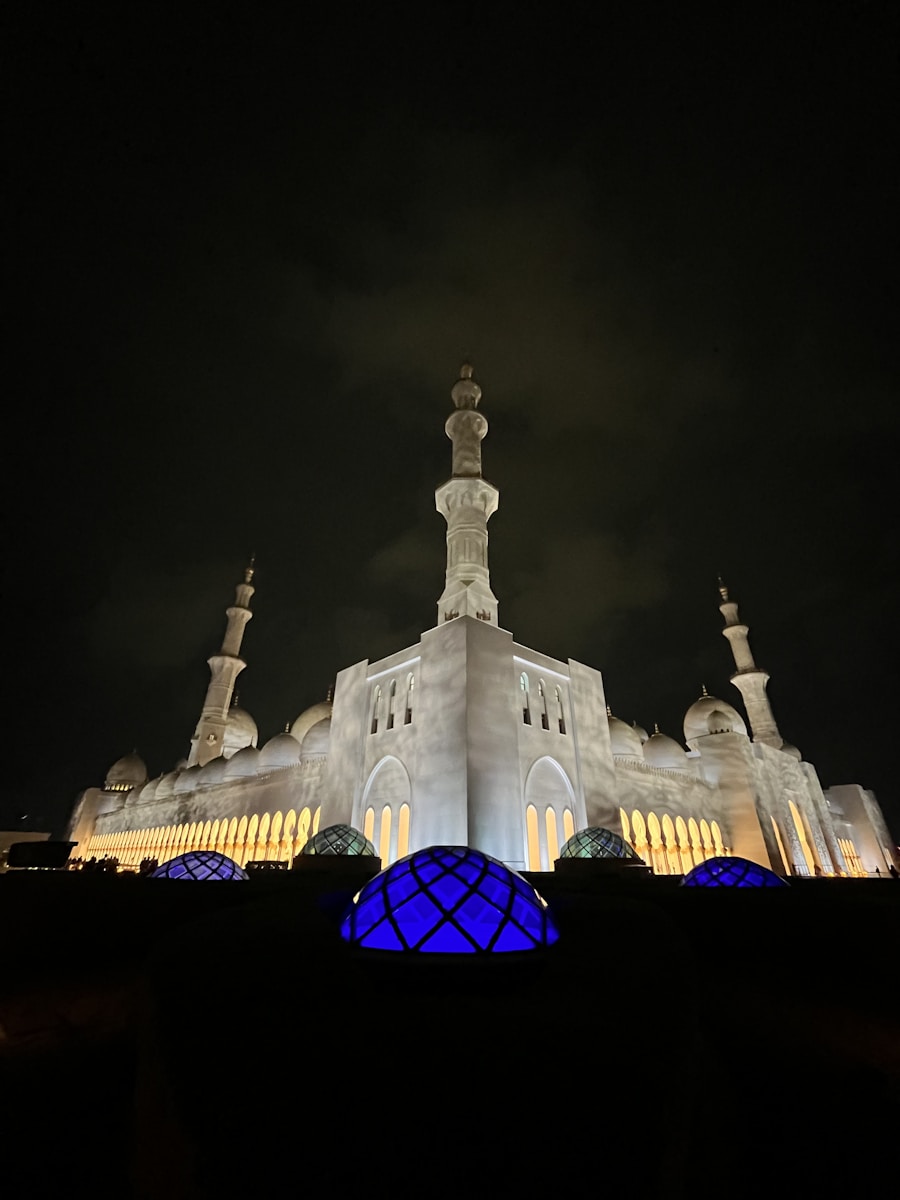 Sheikh Zayed Grand Mosque glowing white at twilight