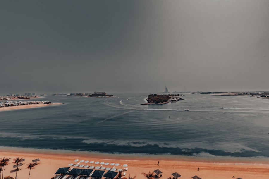 Sandy Palm Jumeirah beach with a boat drifting offshore