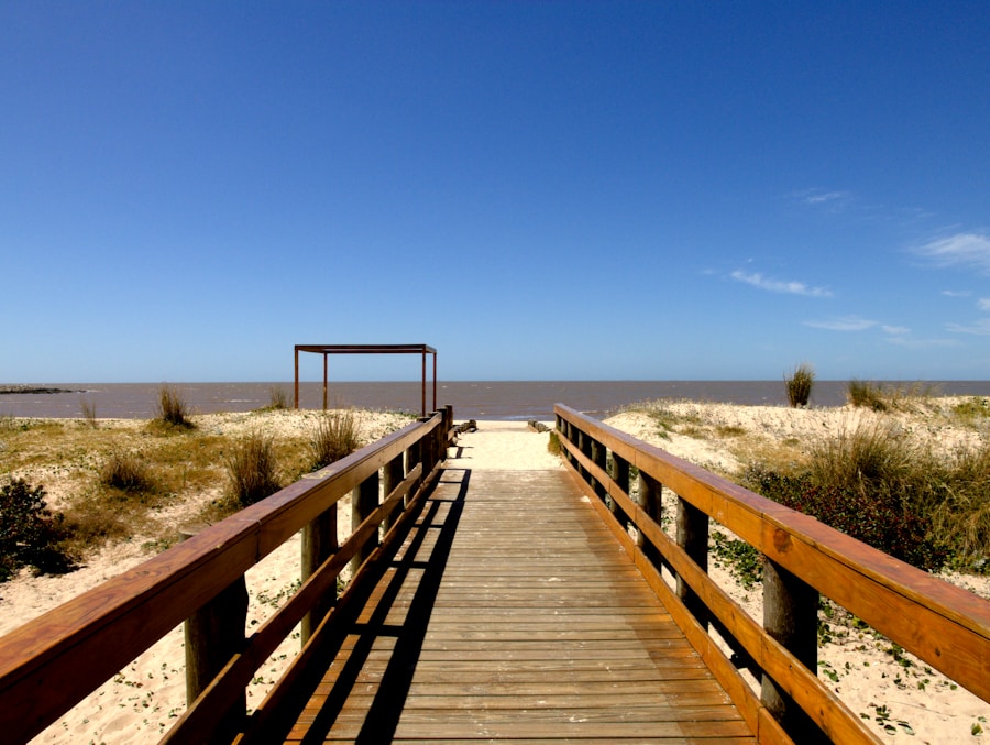 Pier stretching across a calm Uruguayan beach