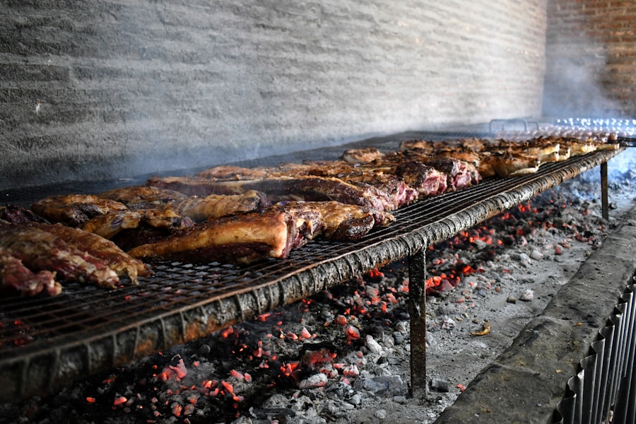 Beef ribs sizzling over glowing asado coals